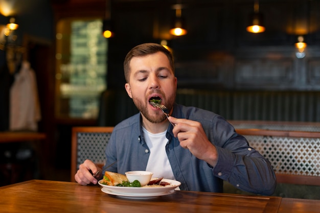 Medium shot man eating