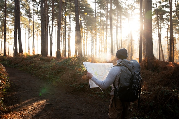 Free Photo medium shot man exploring with map