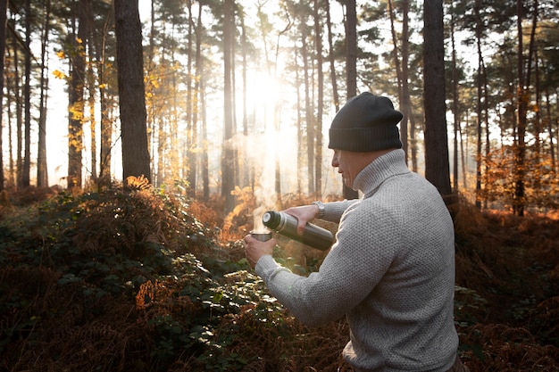 Medium shot man in forest