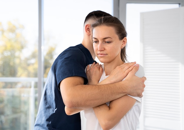 Medium shot man helping woman