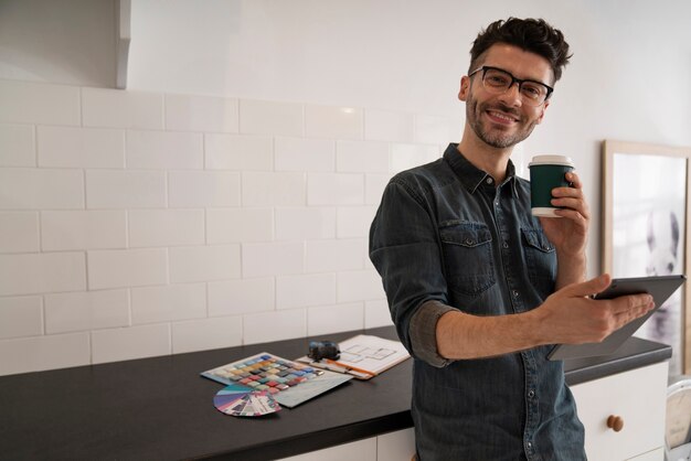 Medium shot man holding coffee cup