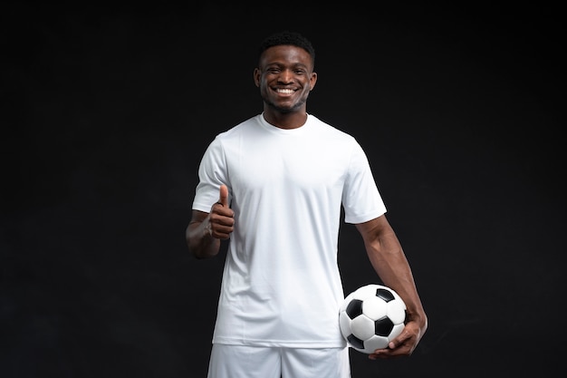 Free photo medium shot man holding football