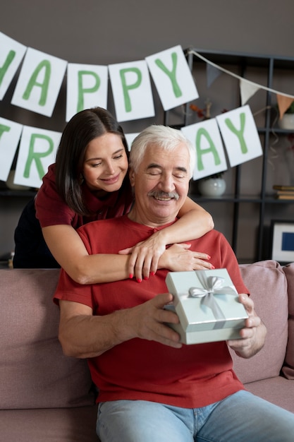 Medium shot man holding gift