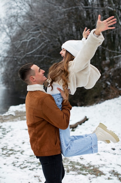 Medium shot man holding girl