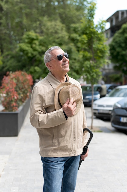 Medium shot man holding hat