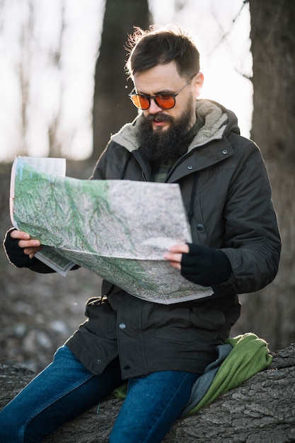 Free Photo medium shot man holding map