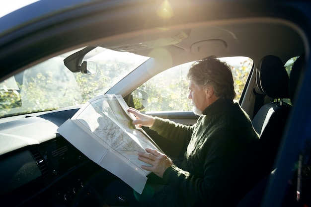 Medium shot man holding map