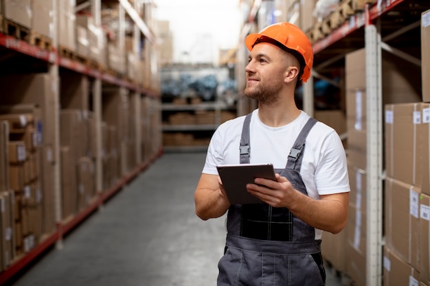 Medium shot man holding tablet