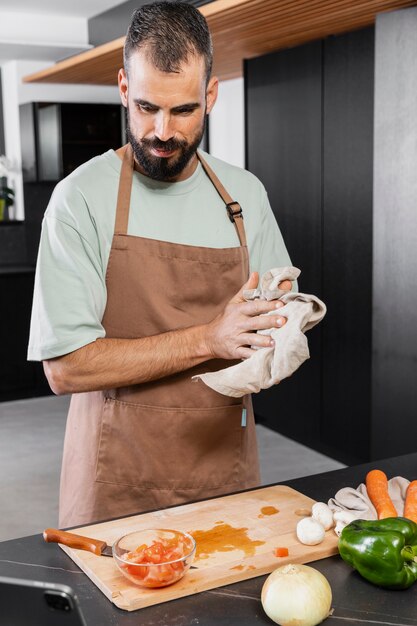 Medium shot man holding towel