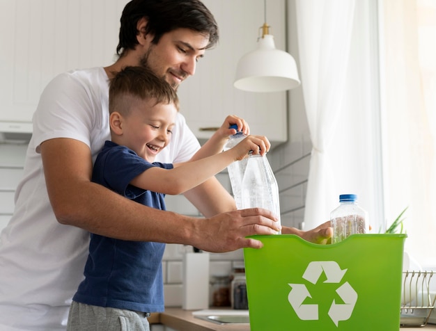 Medium shot man and kid recycling