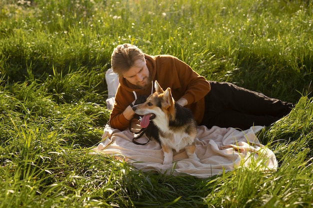 Free Photo medium shot man petting dog