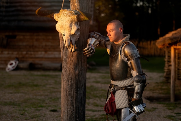 Free Photo medium shot man posing as a medieval soldier