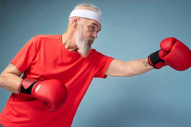 Free photo medium shot man posing with gloves