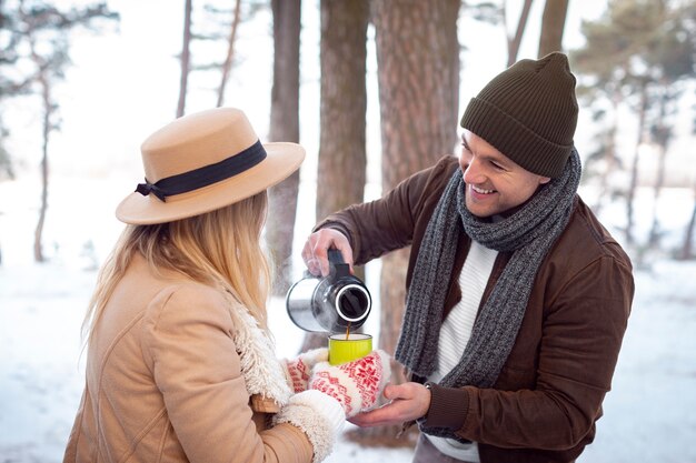 Medium shot man pouring coffee