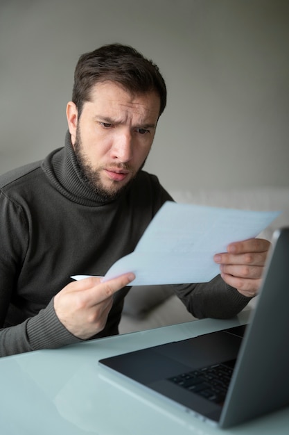 Free Photo medium shot man reading paper