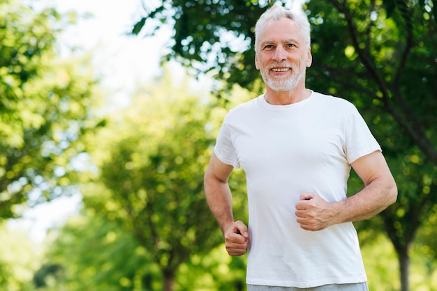 Medium shot man running outdoors