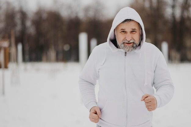 Medium shot man running outside