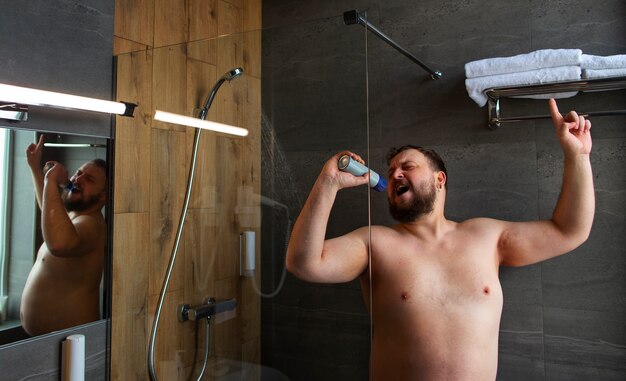 Medium shot man singing in shower