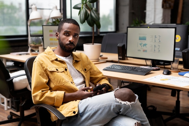 Medium shot man sitting at desk