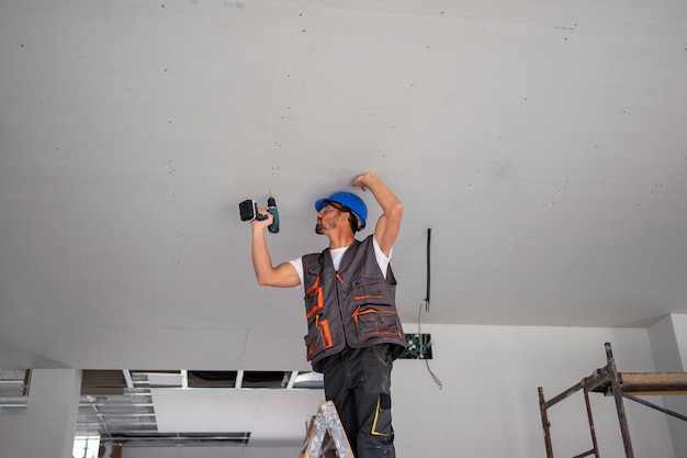 Free Photo medium shot man standing on ladder