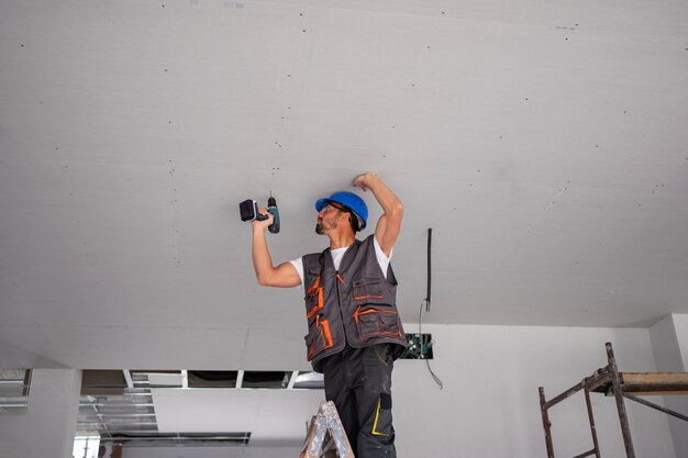 Medium shot man standing on ladder