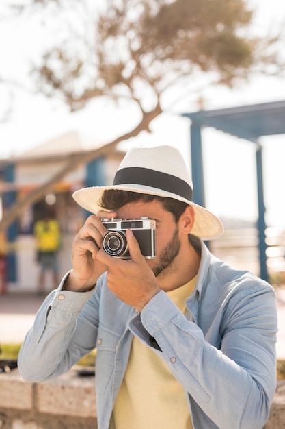 Medium shot man taking photos