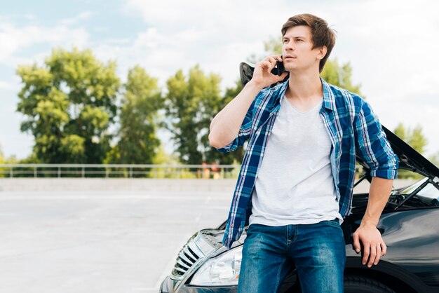 Medium shot of man talking on phone