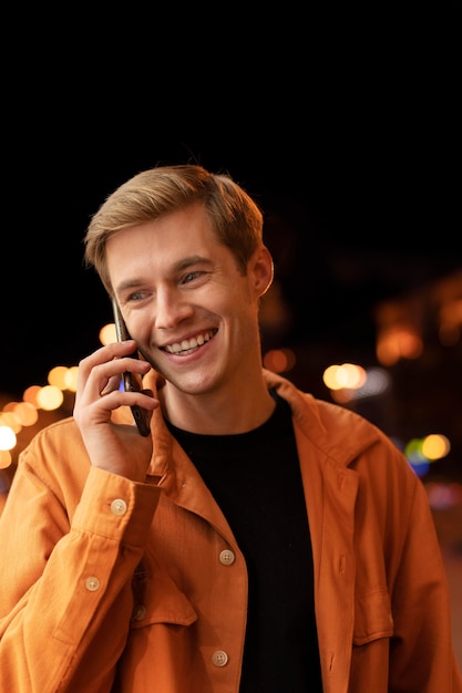 Medium shot man talking on phone