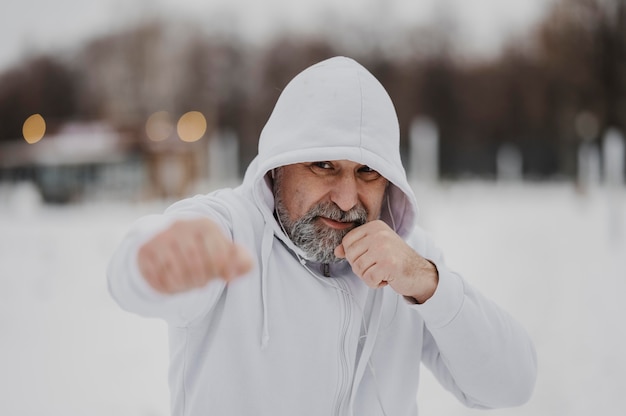 Medium shot man training outside