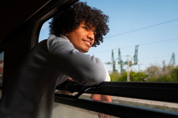 Medium shot man traveling by train