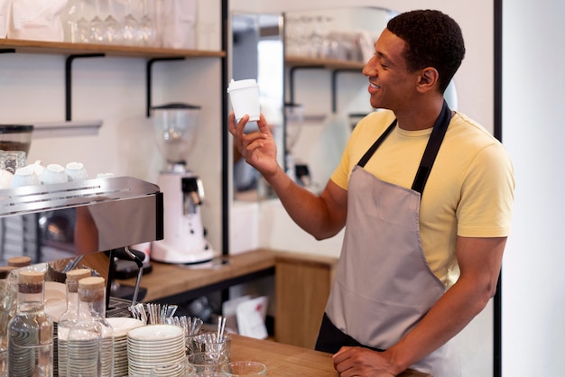 Medium shot man wearing apron