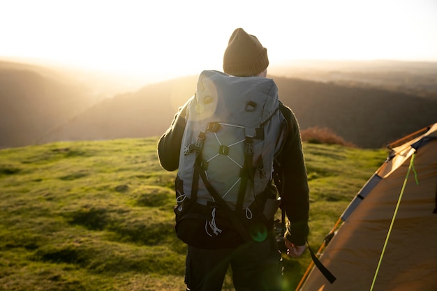 Free photo medium shot man wearing backpack