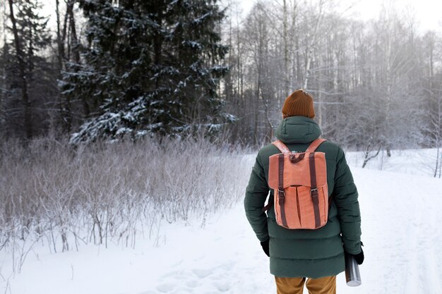 Medium shot man wearing backpack