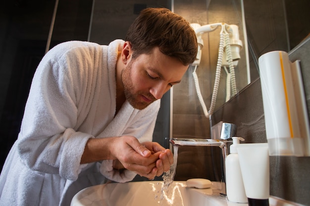 Free Photo medium shot man wearing bathrobe