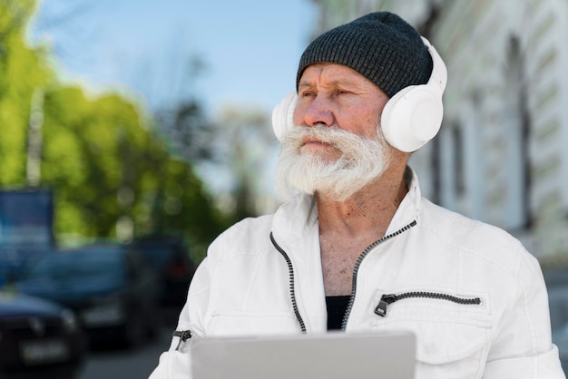 Medium shot man wearing headphones