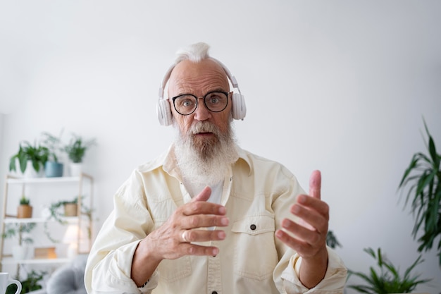 Free Photo medium shot man wearing headphones