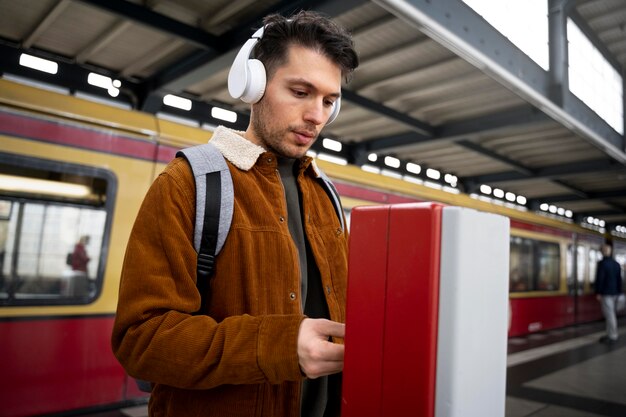 Medium shot man wearing headphones