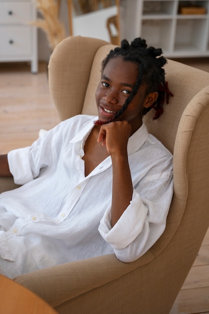 Free photo medium shot man wearing linen clothing at home