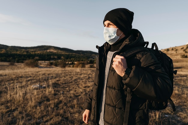 Medium shot man wearing mask