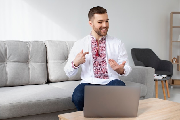 Free photo medium shot man wearing traditional shirt