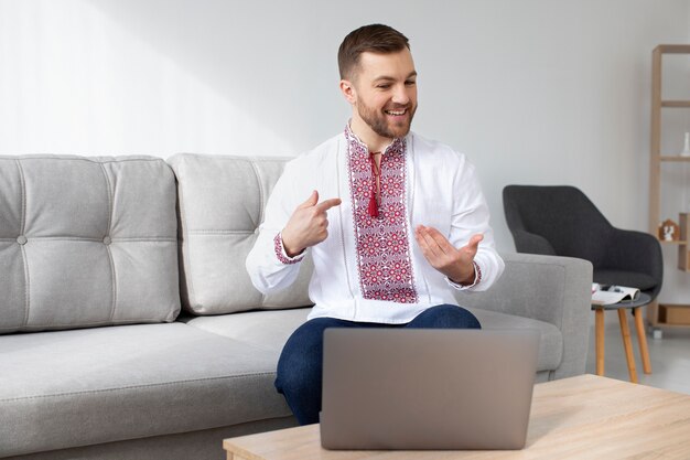 Medium shot man wearing traditional shirt