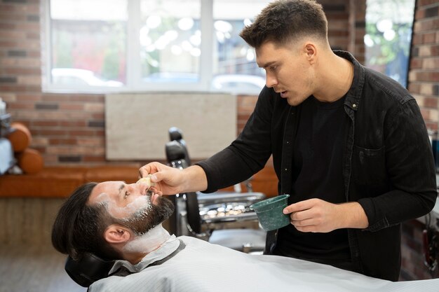 Medium shot man with shaving cream