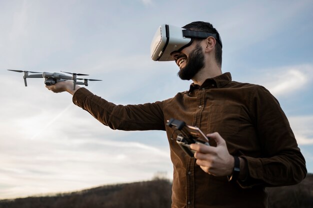 Medium shot man with vr glasses outside