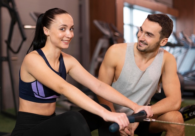 Medium shot man and woman at gym