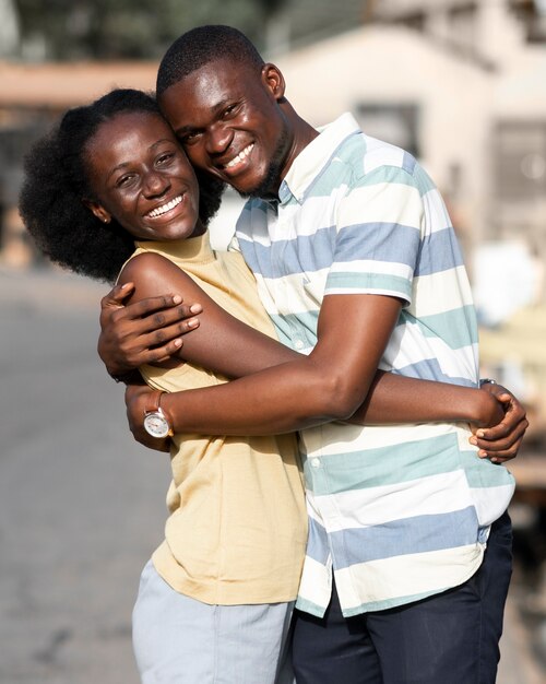 Medium shot man and woman hugging