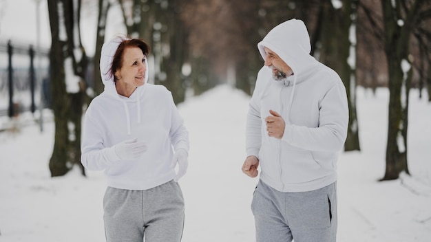 Medium shot man and woman running