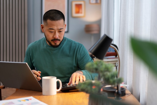 Medium shot man working from home