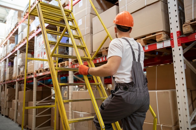 Medium shot man working at warehouse