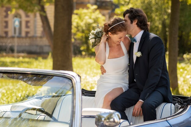 Medium shot married couple on car