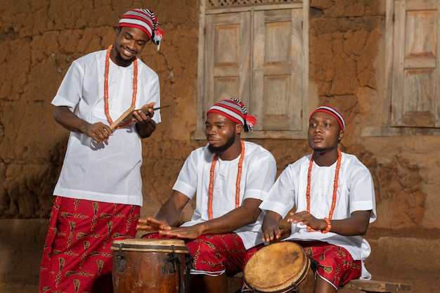 Medium shot men playing drums